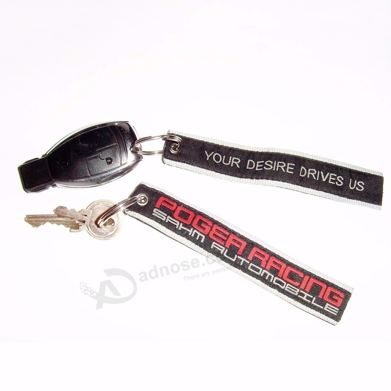 Kundenspezifisches Logo gesponnenes keychain Stickereigroßverkauf Fördernde Verwendung Andenkenbaumwollhochzeit gesponnenes keychain