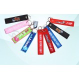 goedkope aangepaste borduurwerk stof cool sleutelhangers tag / verwijderen voor vlucht Key Tag voor souvenir (XF-KC-E09)