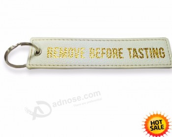 Nenhum MOQ personalizado barato logotipo de ouro tecido alfabeto PU letras tecido logotipos de vôo legal chaveiros tag, aeronaves Key Tags