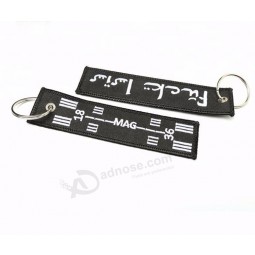 Fabrikmasse produzierte kundenspezifische Markennamengewebe Schlüsselumbauten beide Seiten gestickte kühle keychains Umbau der Luftmannschaft