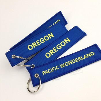 Cheap custom jet fabric key tag/durable embroidery keychain