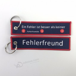 Gewebter, bestickter Schlüsselanhänger mit Schlüsselring