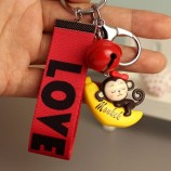 reizender Plastikaffe, der Bananen-Action-Figur PVC keychain Halter reitet