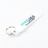 white embroidery keychain with three colors on logo