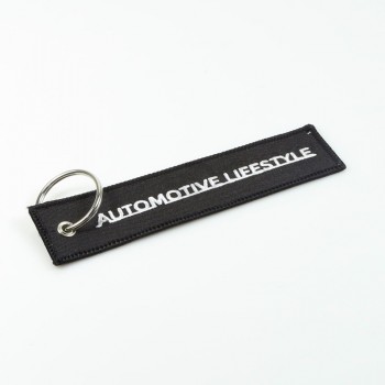 porte-clés brodé noir avec logo brodé blanc