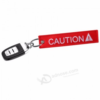 Porte-clés rouge pour voitures et motos 1PC 13X2.8cm Caution lettre porte-clés Anneau pour voitures porte-clés Bijoux de mode