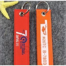 Porte-clés tissé avec logo textile en tissu pour tirette de fermeture éclair avec œillet