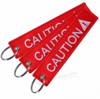 vente chaude personnalisé en gros personnalisé tissu broderie patch porte-clés étiquette brodé porte-clés porte-clés porte-clés porte-clés