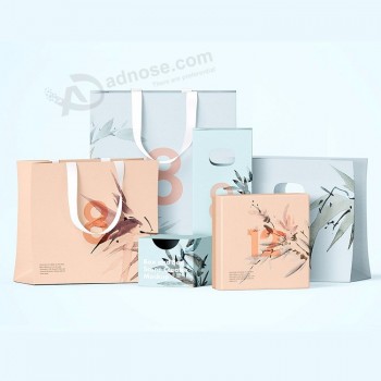 Logo personnalisé imprimé sac en papier d’achat Emballage de chaussures de vêtements Sac en papier cadeau lavable bon marché