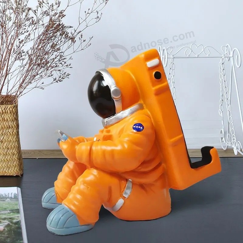 カスタマイズされた創造的な宇宙飛行士の携帯電話ホルダークリスマスのための最高の贈り物を立てる