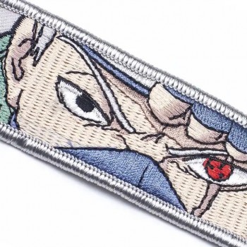 Tela tejida de letras Llavero bordado de motocicleta en blanco personalizado Etiqueta de chorro de llave de anime bordada para automóvil y motocicleta