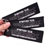 Logo personalizzato nero FLIGHT Angel Wings Portachiavi per auto ricamato Portachiavi ricamati Jet Tags su sfondo nero