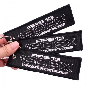 Logo personalizzato nero FLIGHT Angel Wings Portachiavi per auto ricamato Portachiavi ricamati Jet Tags su sfondo nero
